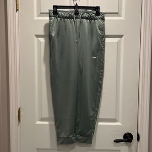 Green Nike joggers.